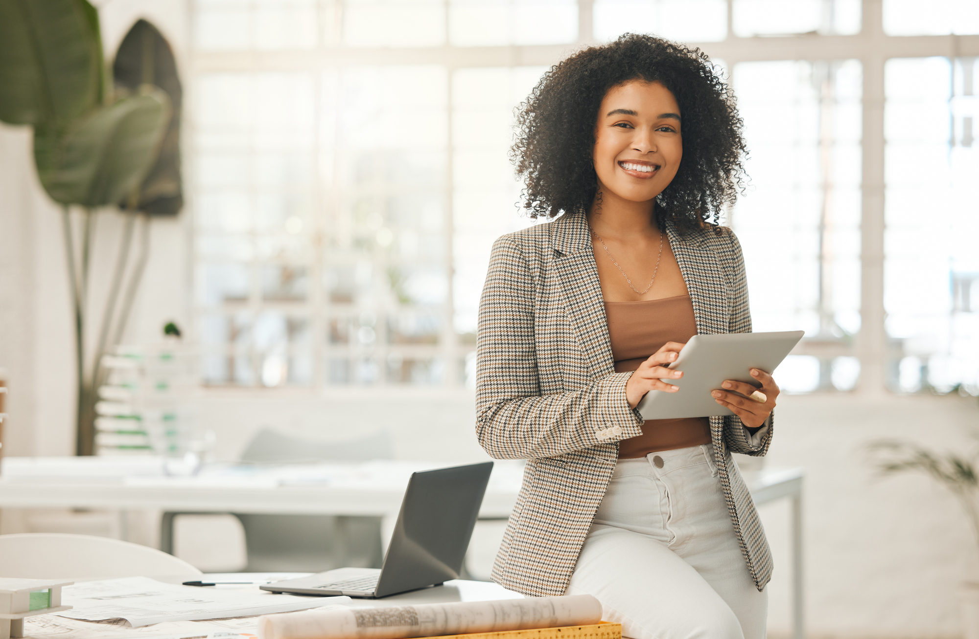 woman holding a clipboard in an office